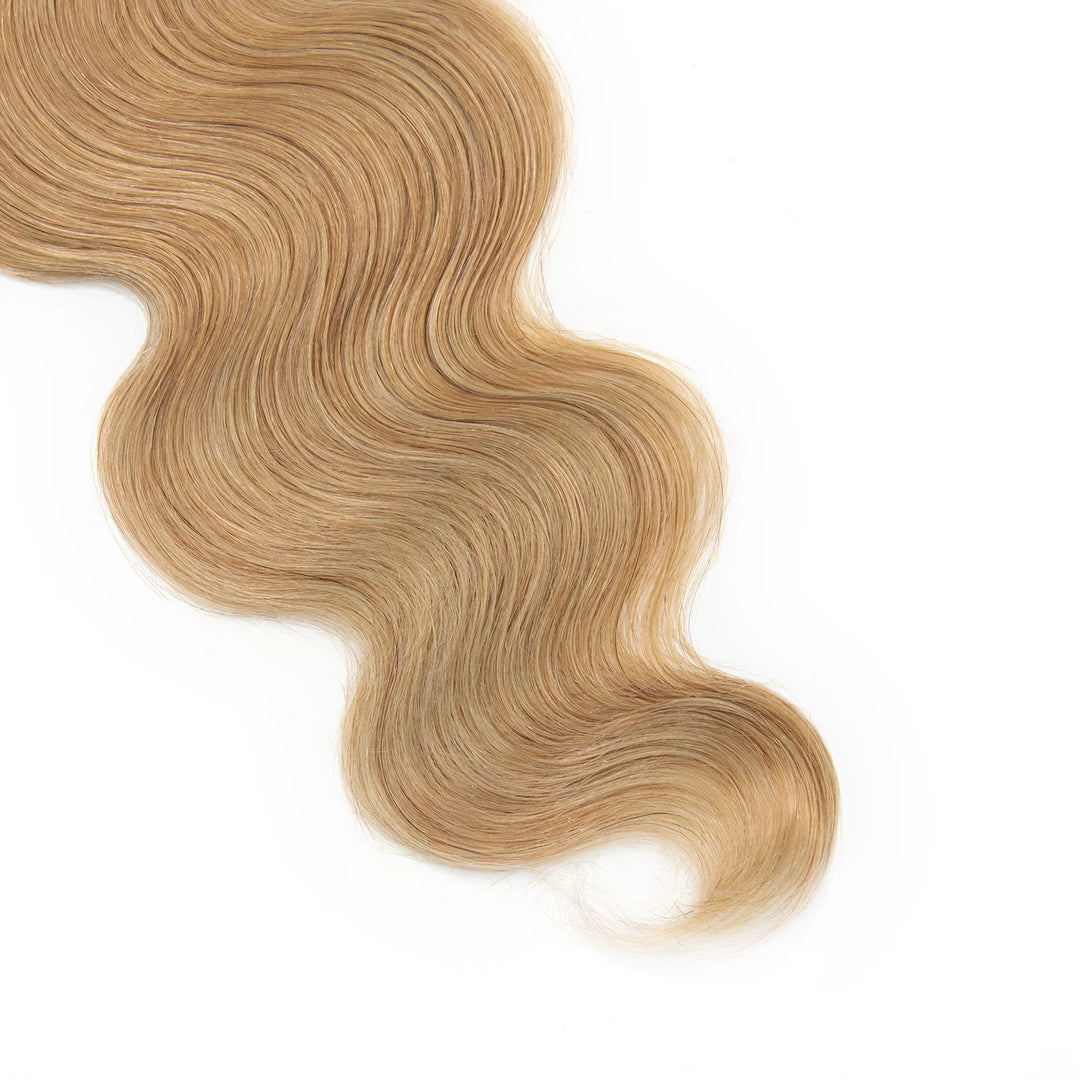 Close-up of Ywigs #27 Honey Blonde Body Wave Braiding Hair ends showing soft defined waves