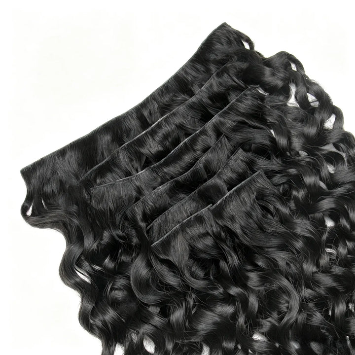 Close-up of Ywigs Invisible Edge Clip In Water Wave Hair Extensions showing defined water wave pattern and natural shine