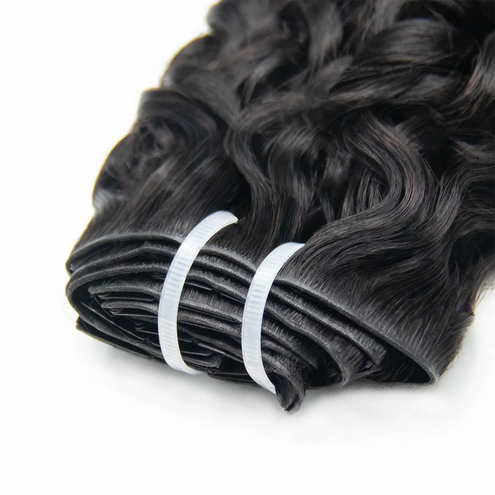 Close-up of Ywigs Invisible Edge Clip In Water Wave Hair Extensions showing defined water wave pattern and natural shine
