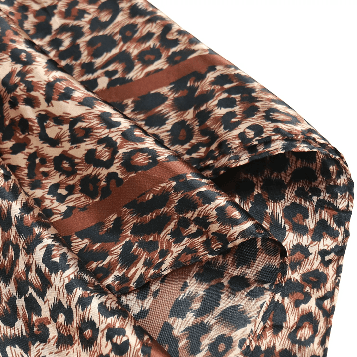 Close-up of Ywigs Leopard Print Satin Hair Scarf showing the smooth satin fabric and leopard print pattern
