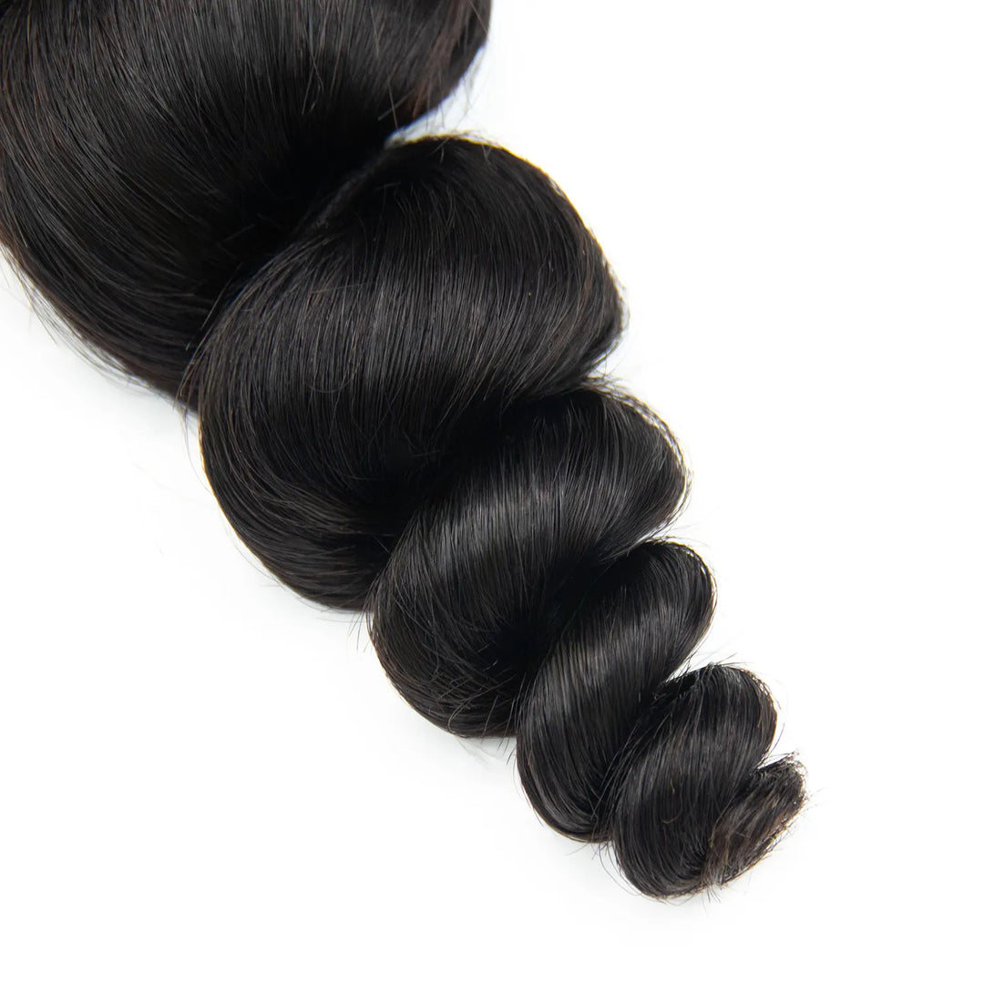 Close-up of Ywigs loose wave human hair showing neat bouncy loose wave and silky soft texture
