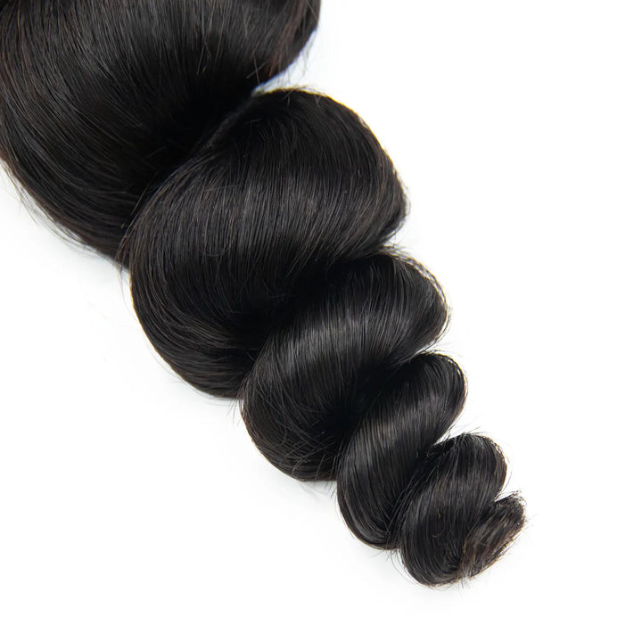 Close-up of Ywigs loose wave human hair showing neat bouncy loose wave and silky soft texture