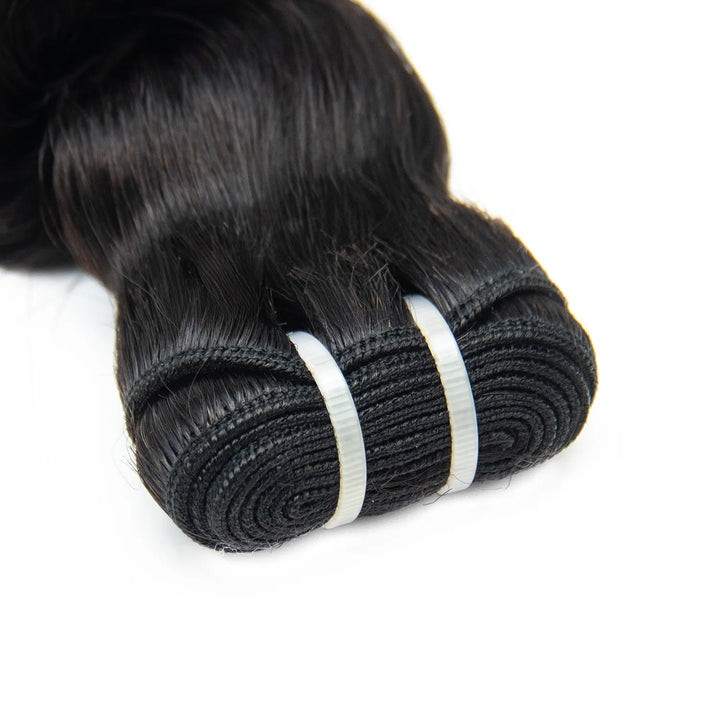 Close-up of Ywigs loose wave human hair weft showing sturdy double weft and smooth hair strands