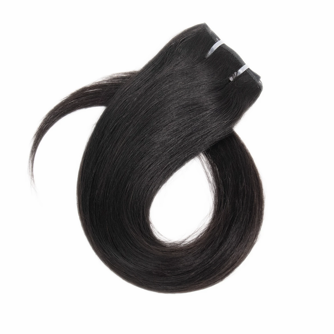 Close-up of Ywigs Silky Straight Genius Weft Human Hair showing defined spring twist curl pattern and soft texture