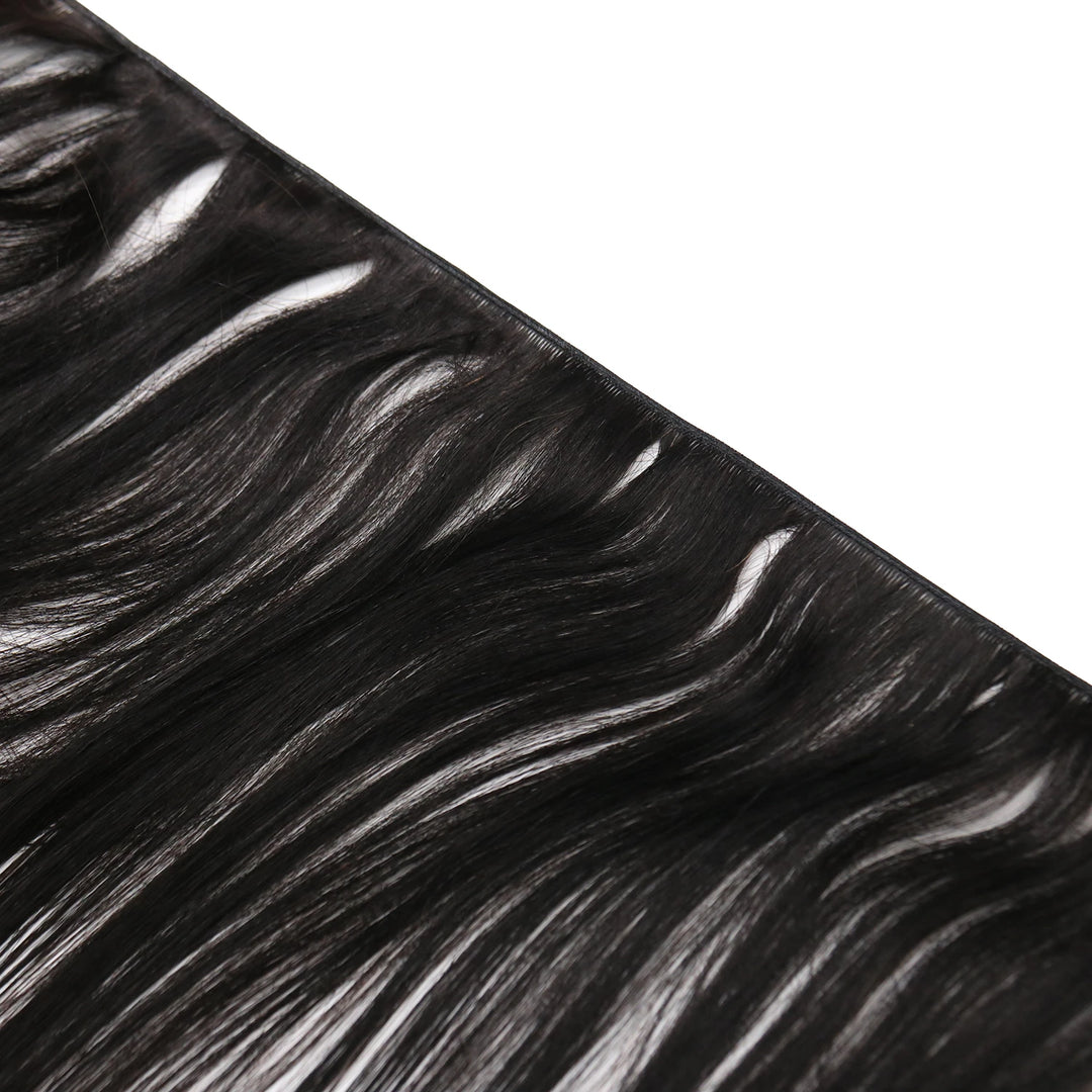 Close-up of Ywigs Silky Straight Genius Weft Human Hair showing defined spring twist curl pattern and soft texture