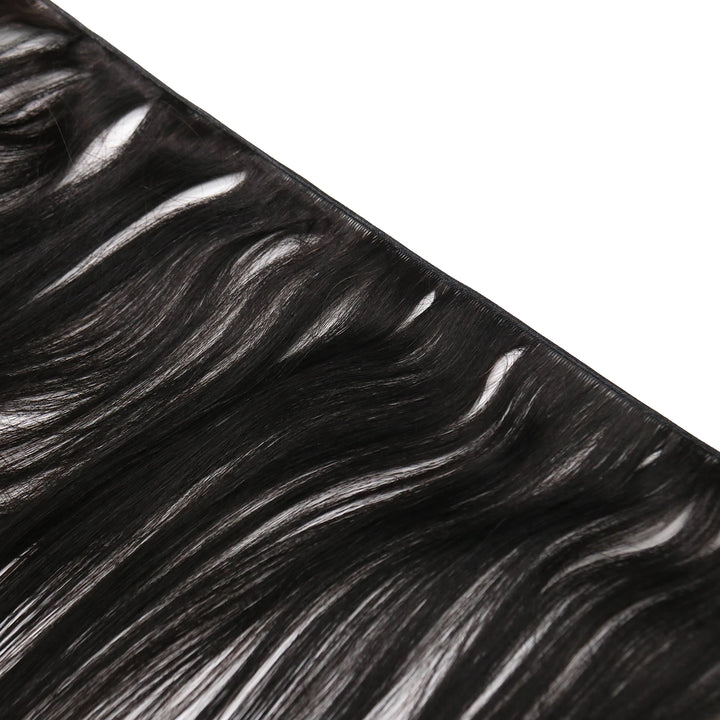 Close-up of Ywigs Silky Straight Genius Weft Human Hair showing defined spring twist curl pattern and soft texture