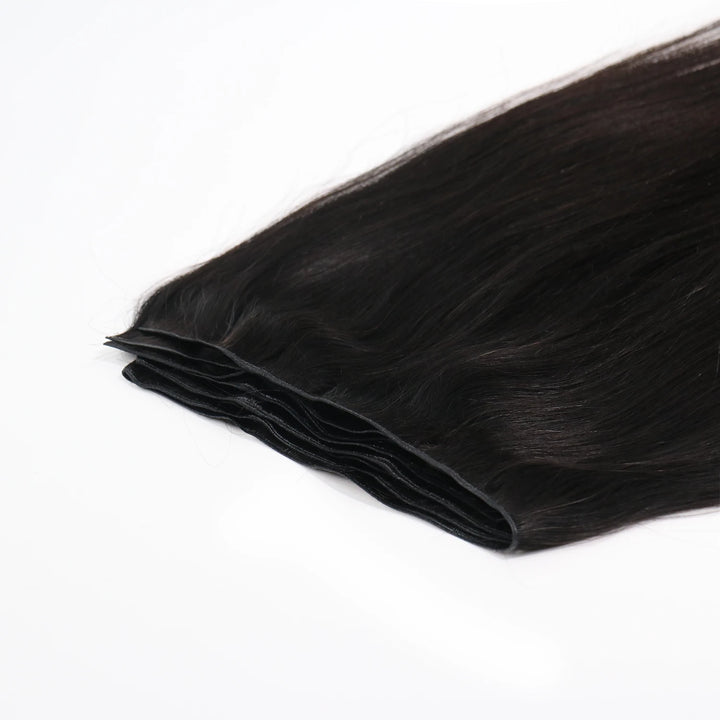 Close-up of Ywigs Silky Straight Ultra Thin Genius Weft showing thin and flat weft construction