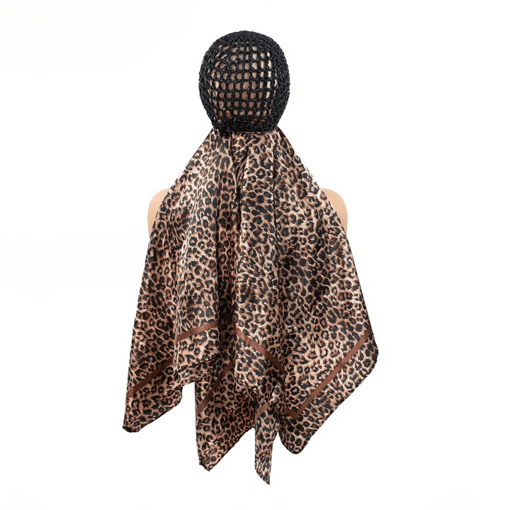 Back view of model wearing Ywigs 2-in-1 Leopard Print Satin Hair Scarf with Mesh Cap showing the long flowing scarf