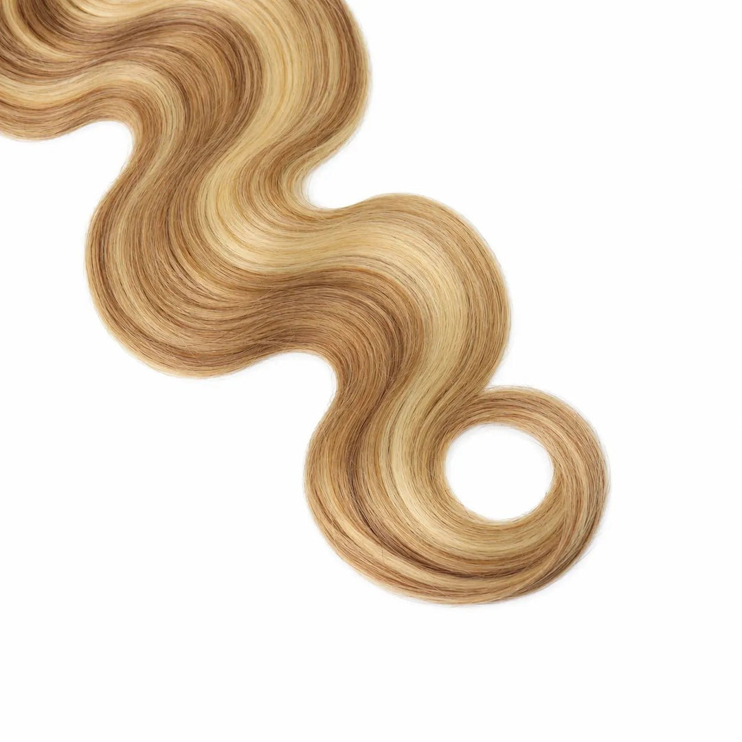 Close-up of Ywigs #27/#613 Body Wave Human Crochet Hair highlighting its smooth S-shaped waves and dimensional blonde color.