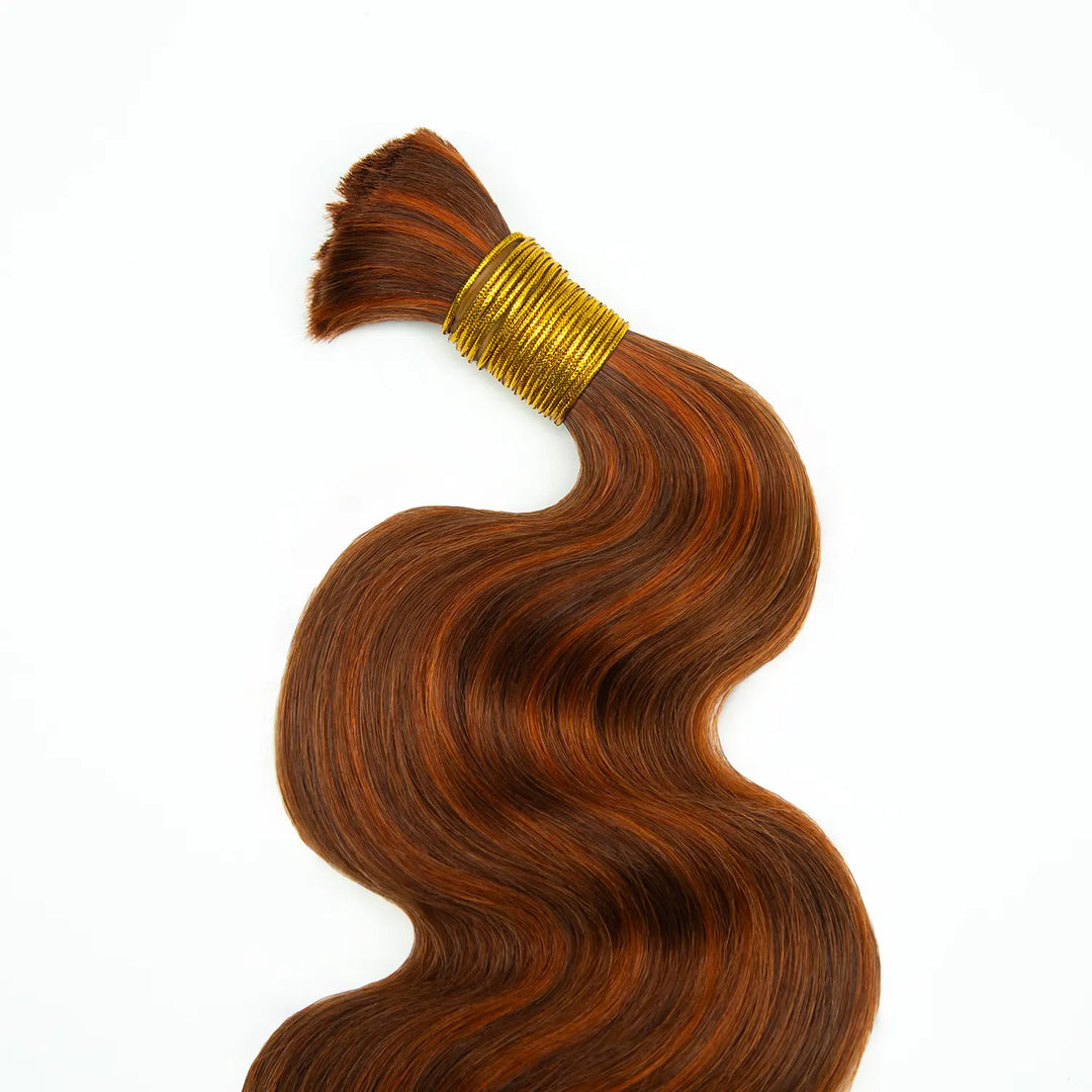 Top view of Ywigs #350/Auburn Body Wave Bulk Human Braiding Hair showing smooth strands and warm copper tones