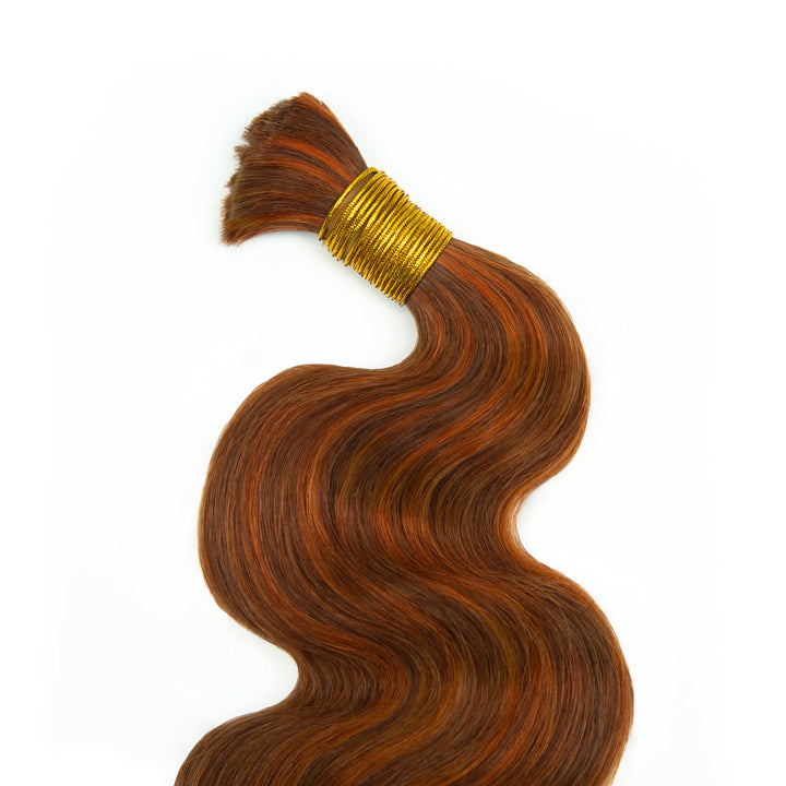 Top view of Ywigs #350/Auburn Body Wave Bulk Human Braiding Hair showing smooth strands and warm copper tones