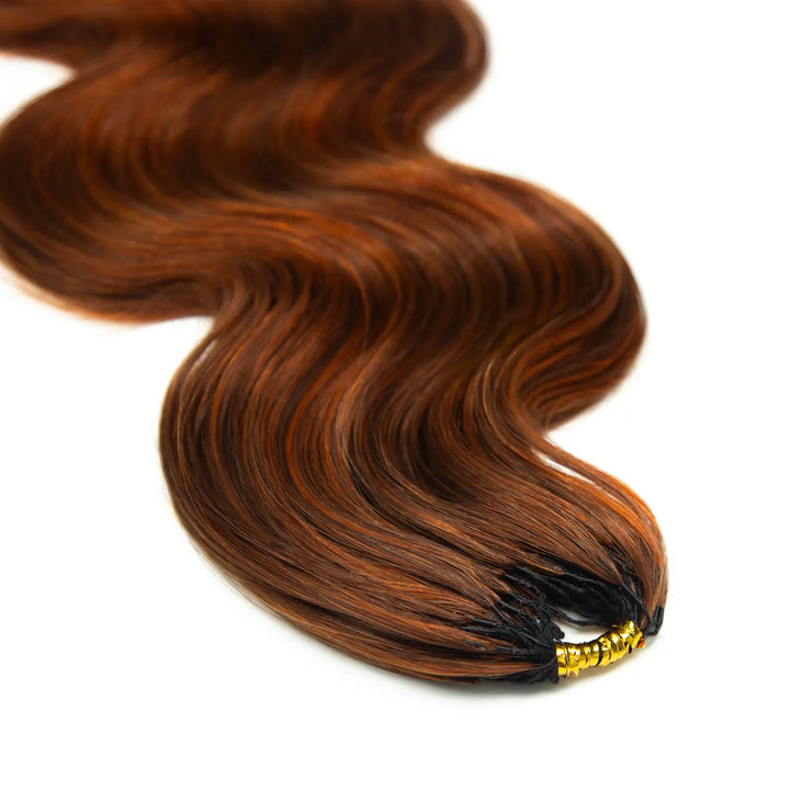Top view of Ywigs #350/Auburn Blend Body Wave Human Crochet Hair showing neatly gathered strands and copper tones