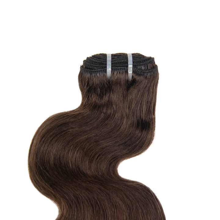 Close-up of the double machine-weft construction on Ywigs #4 Medium Brown Burmese Water Curly Human Hair