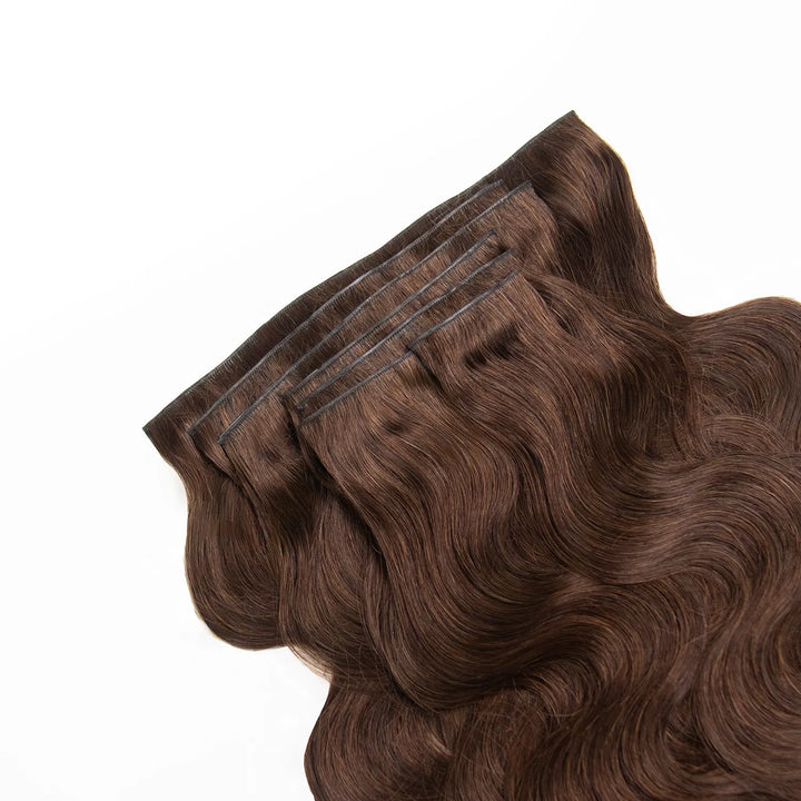 Close-up of a Ywigs #4 Medium Brown Clip In Hair Extension weft showing smooth strands and natural brown color