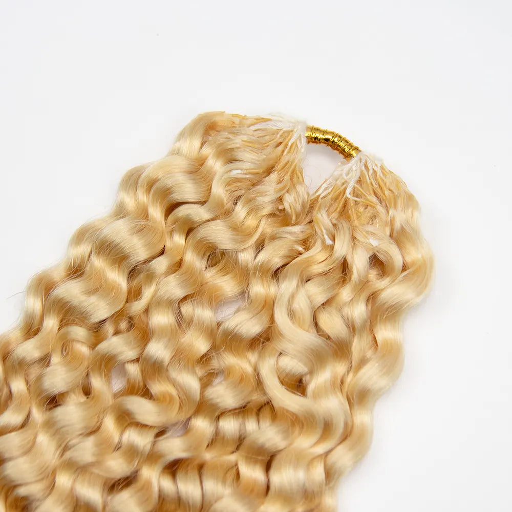 Close-up of the top of Ywigs #613 Platinum Blonde Water Wave Human Crochet Hair showing the hair attachment and blonde strands