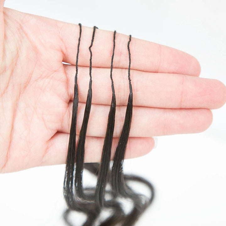 Close-up of Ywigs body wave feather crochet hair texture showing defined spiral curl pattern and natural sheen