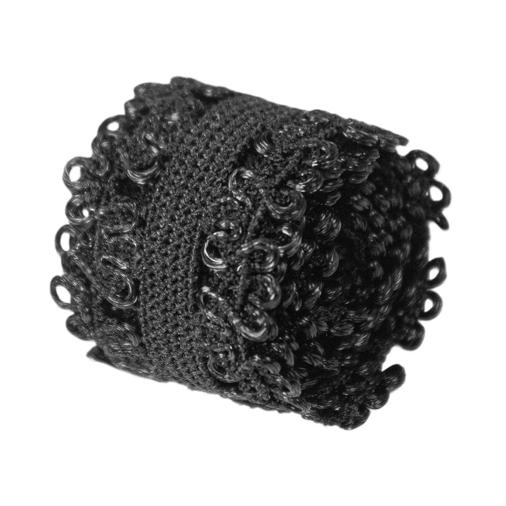 Folded black elastic lace band showing its compact and flexible design.