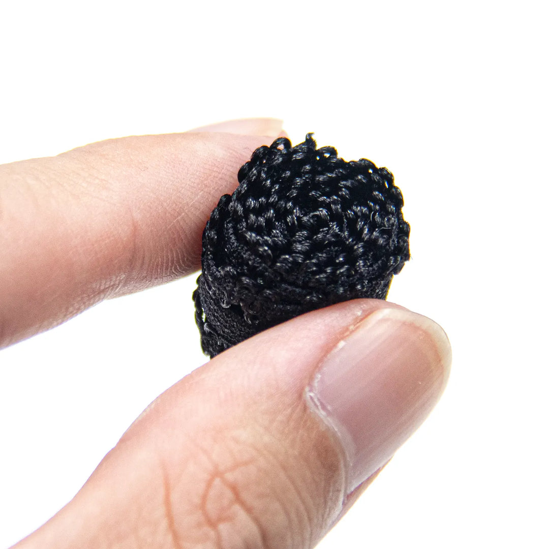 Close-up of the black elastic lace band texture and delicate construction
