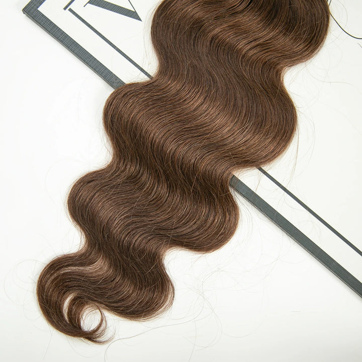 Close-up of Ywigs knotless feather crochet hair tips showing lightweight feathered ends and seamless construction