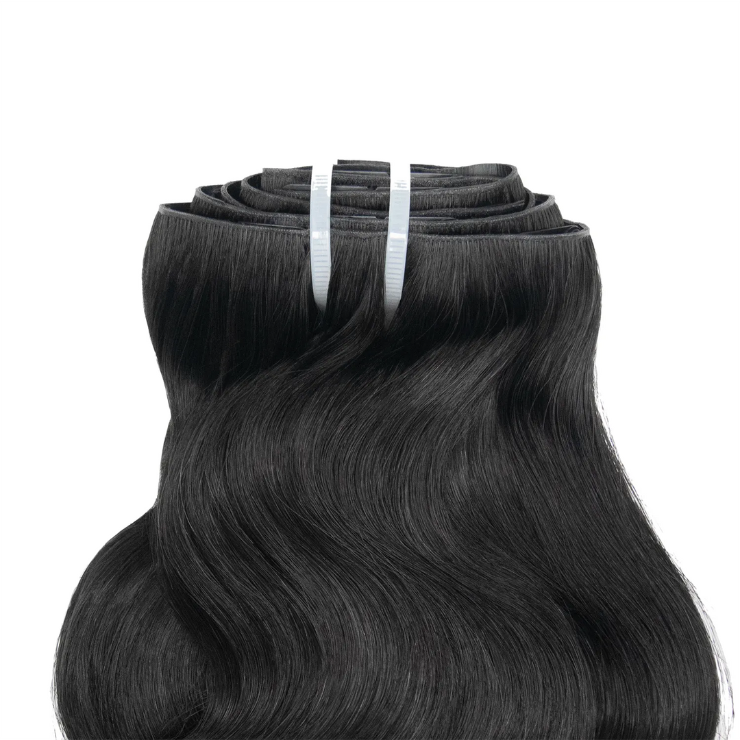 Close-up of Ywigs Invisible Edge Clip In Body Wave Hair Extensions showing defined body wave pattern and natural shine