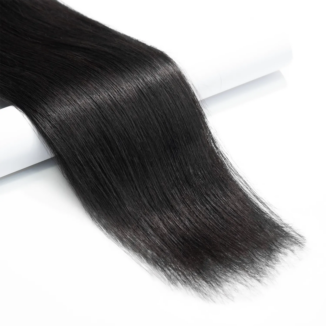 Close-up of Ywigs Silky Straight Clip In Hair Extensions ends showing smooth texture and sleek finish