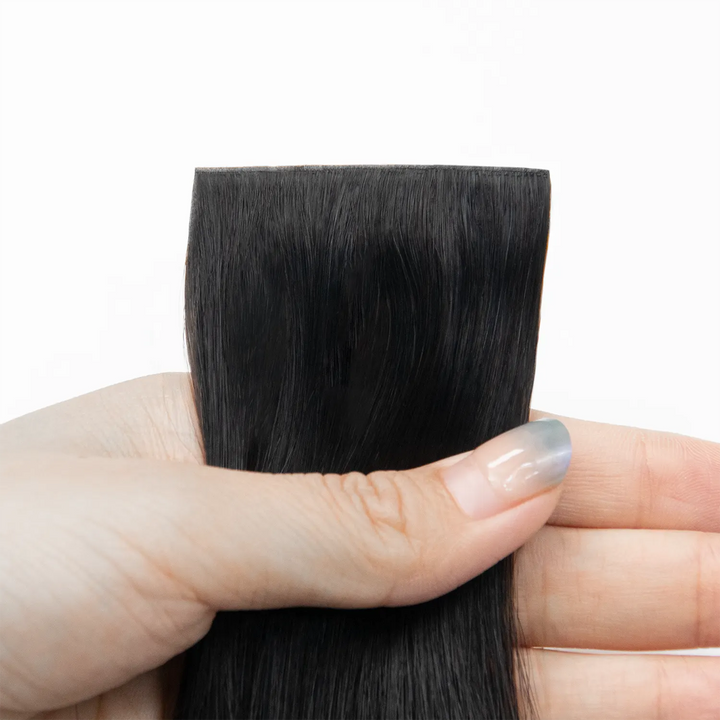 Close-up of Ywigs Invisible Edge Clip In Silky Straight Hair Extensions showing smooth straight texture and natural shine