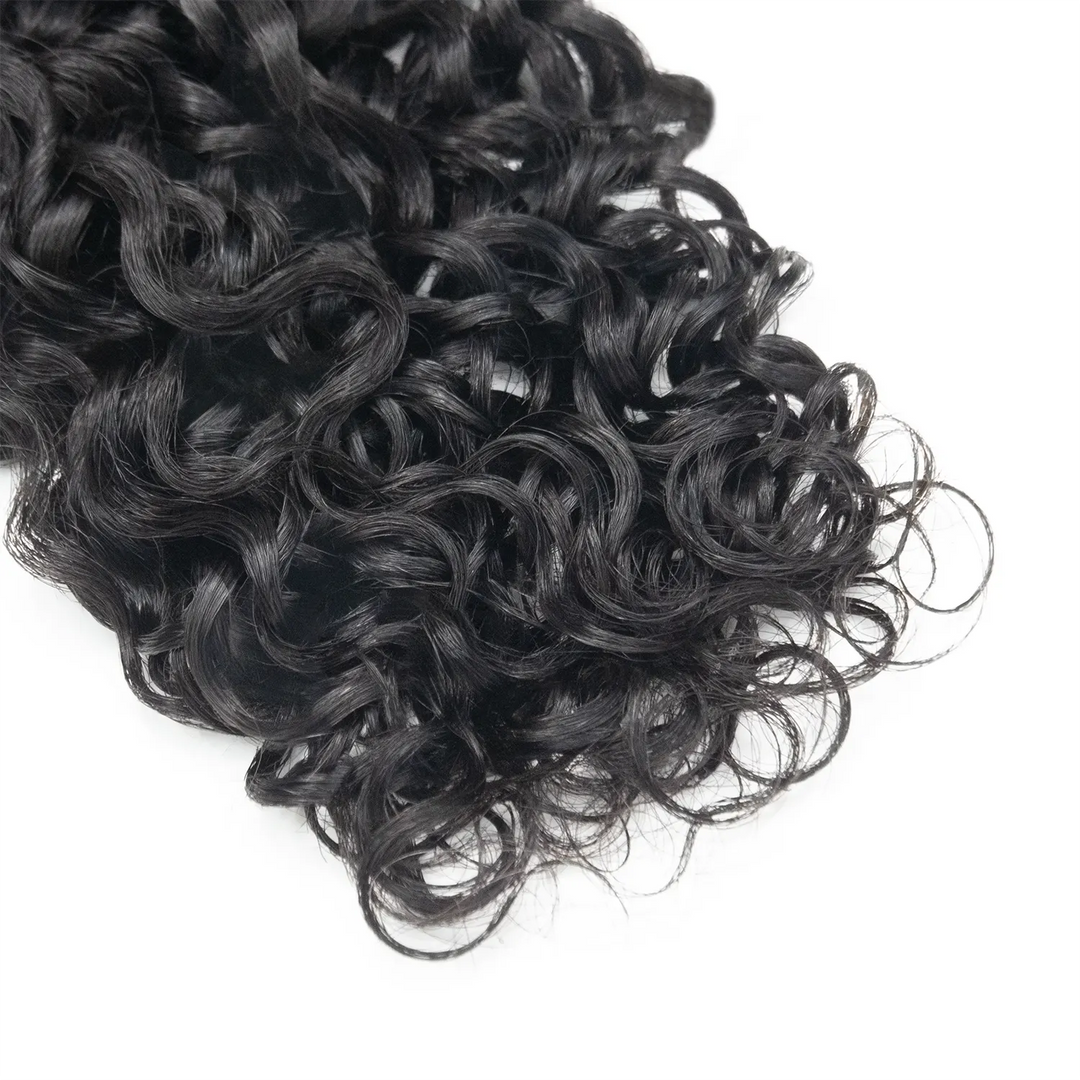 Close-up of Ywigs Water Wave Clip In Hair Extensions ends showing soft waves and natural movement