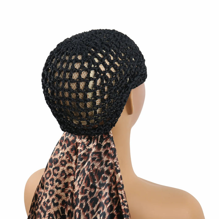 Side view of model wearing Ywigs Leopard Print Satin Hair Scarf with Mesh Cap showing the mesh cap and satin scarf design