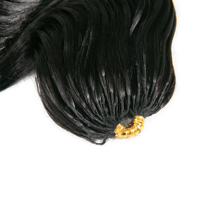 Close-up of Ywigs loose wave feather crochet hair texture showing defined spiral curl pattern and natural sheen