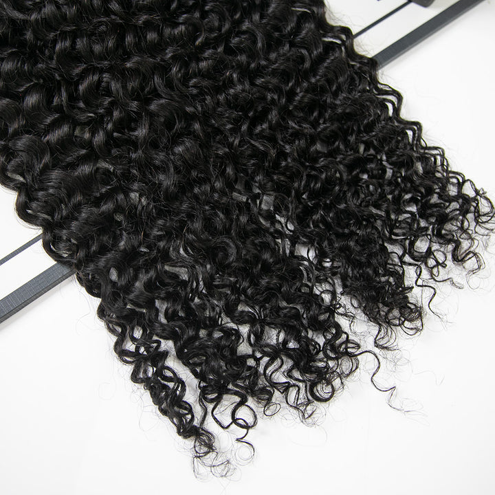 Close-up of Ywigs knotless feather crochet hair tips showing lightweight feathered ends and seamless construction