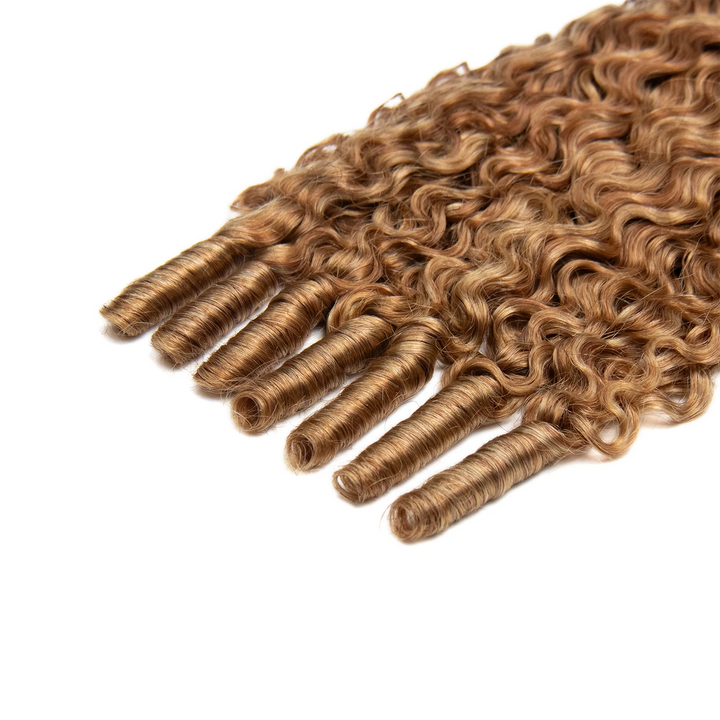 Close-up of Ywigs T1B/27/30/613 Water Curl Genius Weft ends showing soft defined curls