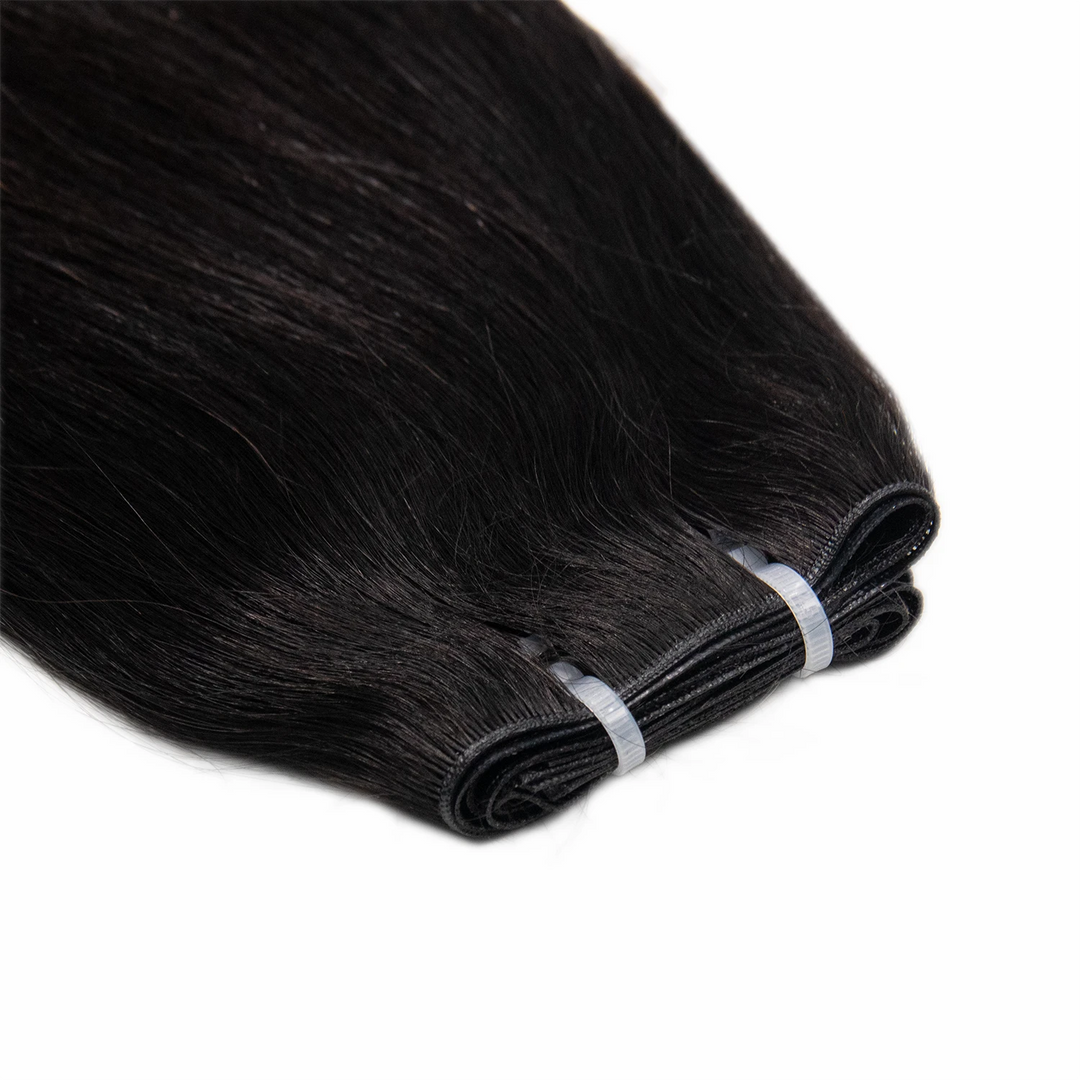 Close-up of Ywigs Silky Straight Ultra Thin Genius Weft showing thin and flat weft construction